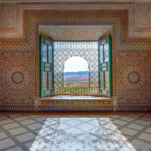 Peering out of a window of the ornately decorated Kasbah Telouet.