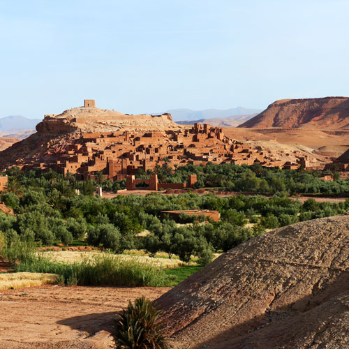 a gorgeous village and kasbahs are nestled in the desert of Greater Southern Morocco.